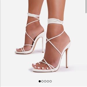 Size 9 Brand new and never worn white lace up heels